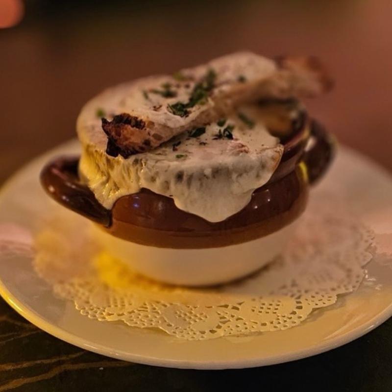 French onion soup with melted cheese and a crouton at Harper's