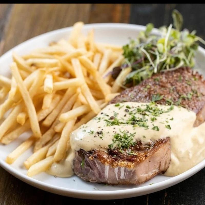 Steak frites with peppercorn cream sauce and shoestring fries at Harper's