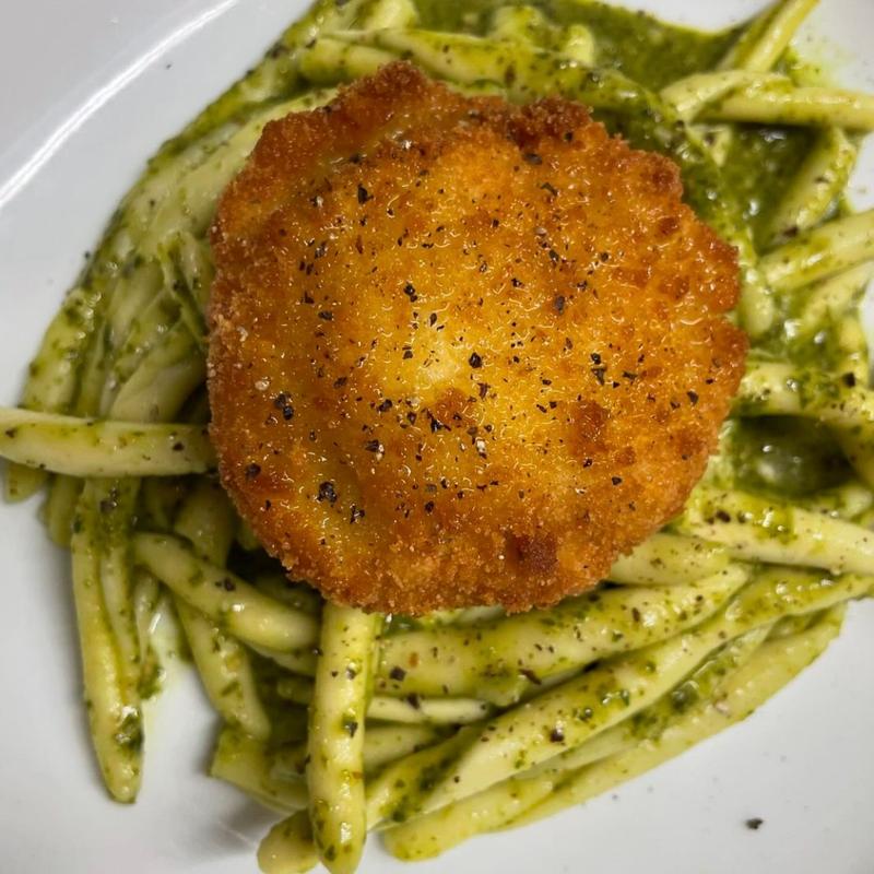 Chicken Milanese over pesto pasta at Harper's